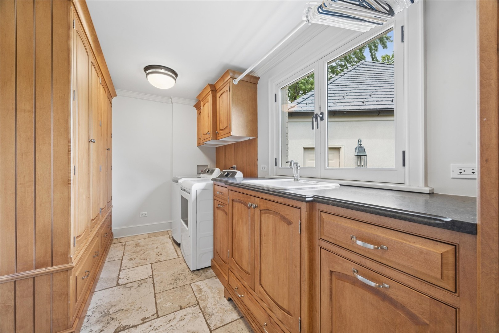 325 Princeton Road Hinsdale, IL 60521 - Photo 24 of 55 a kitchen with a sink cabinets and a window