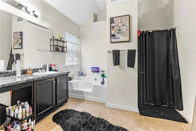 a kitchen with a refrigerator and a sink