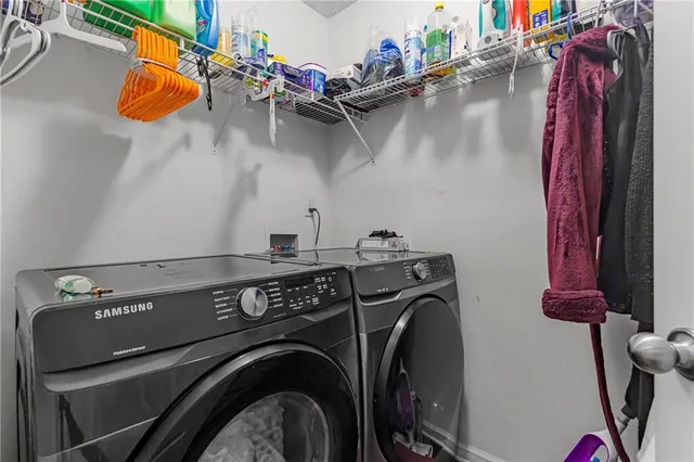 a utility room with dryer and washer