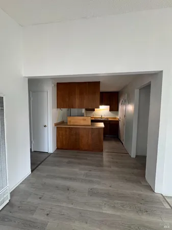 a view of a kitchen with a sink and cabinets