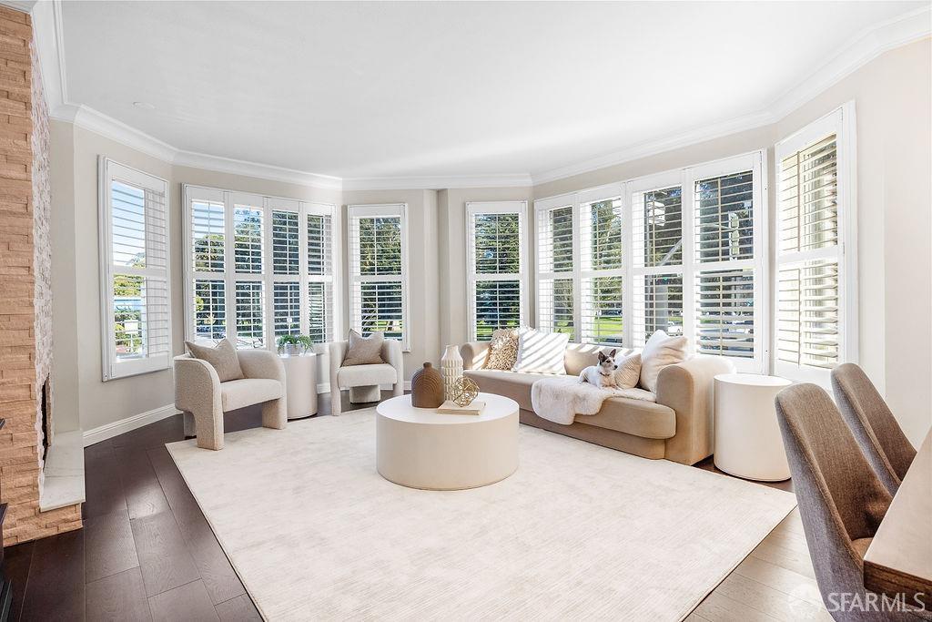 1702 Fell Street, Unit 1 San Francisco, CA 94117 - Photo 1 of 40 a living room with furniture and large windows