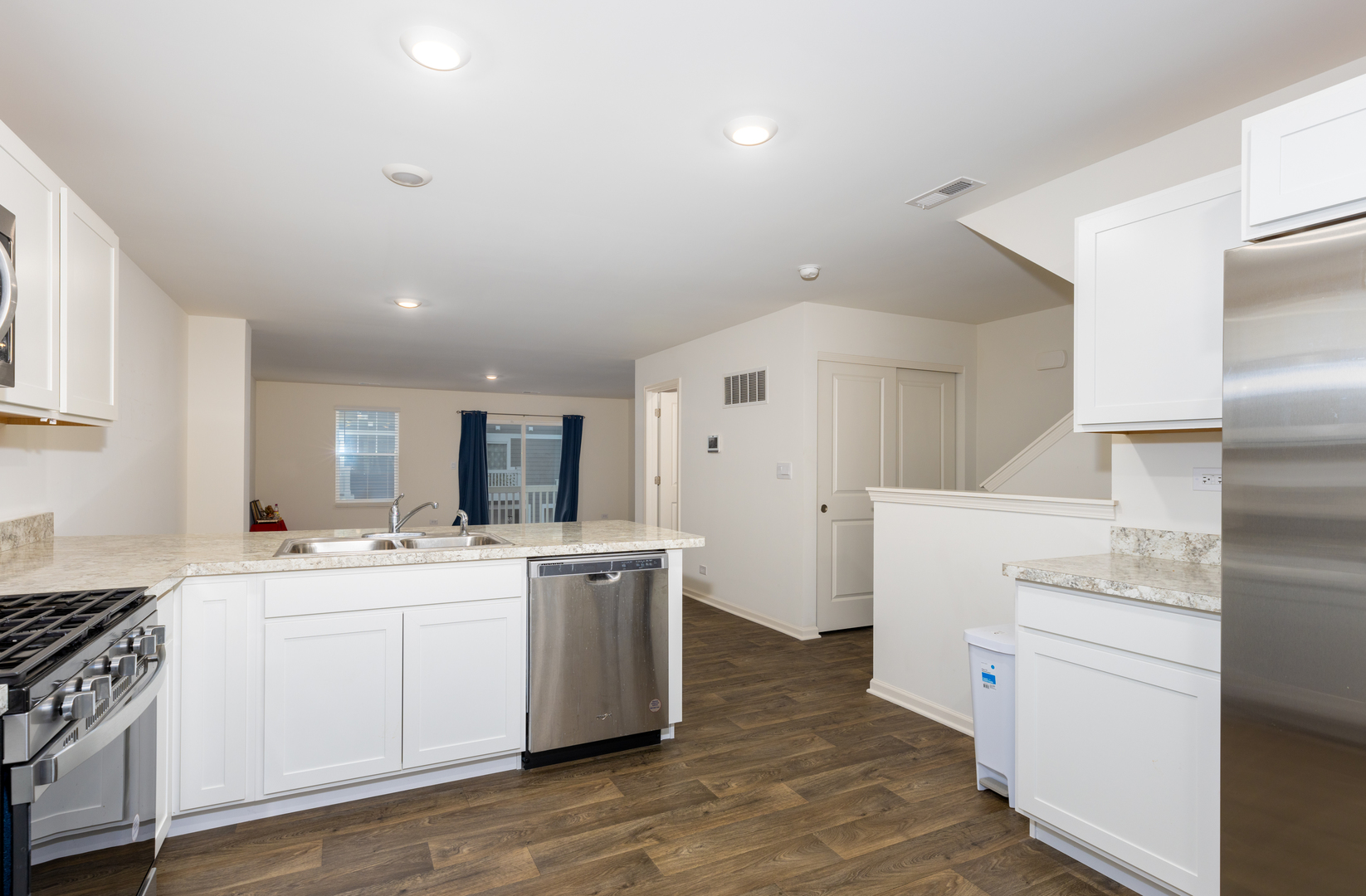 3831 Currant Lane Elgin, IL 60124 - Photo 6 of 19 a kitchen with a stove a sink and a refrigerator