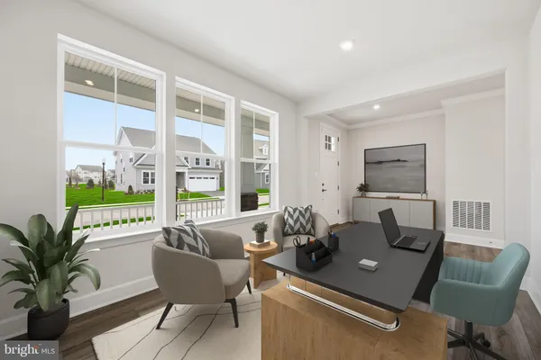 a living room with furniture floor to ceiling window and wooden floor