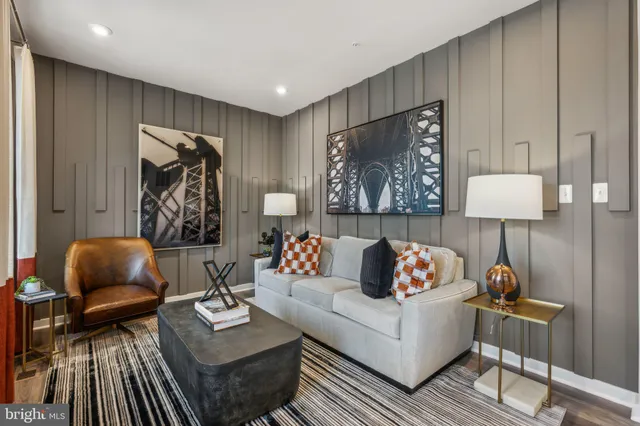 a living room with furniture and a lamp