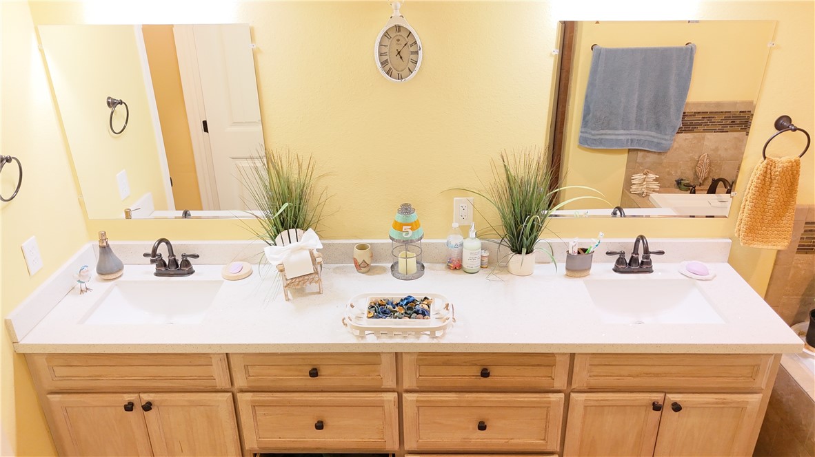 570 County Road 137 Alice, TX 78332 - Photo 19 of 30 a bathroom with a sink and a mirror