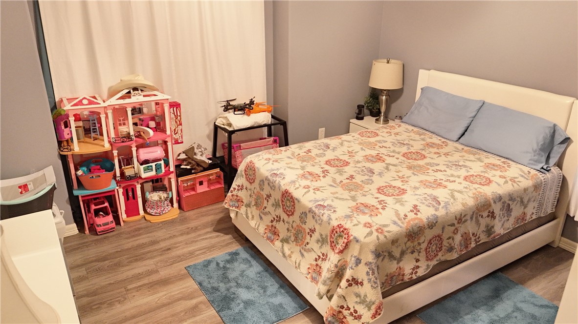 570 County Road 137 Alice, TX 78332 - Photo 26 of 30 a bed sitting in a bedroom next to a window