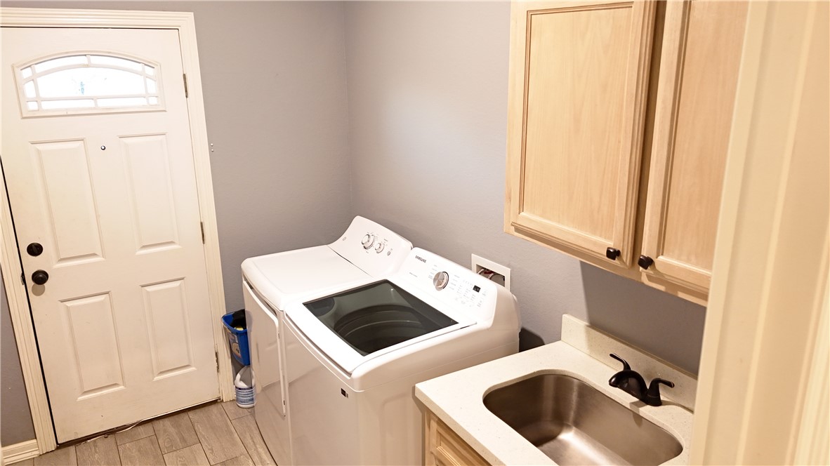 570 County Road 137 Alice, TX 78332 - Photo 28 of 30 a utility room with dryer and washer