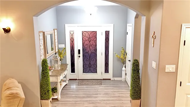 a view of a entryway door with wooden floor