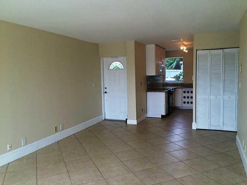 1717 North Riverside Drive Pompano Beach, FL 33062 - Photo 5 of 11 Living room & kitchen