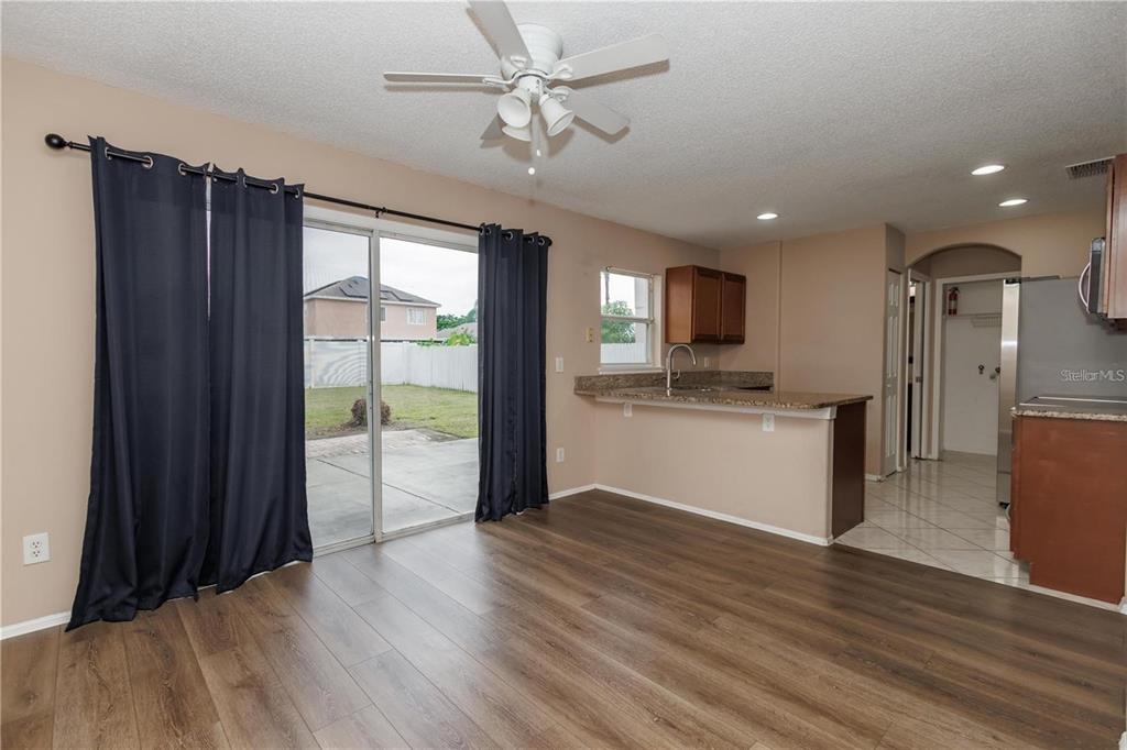 1112 Timberbend Circle Orlando, FL 32824 - Photo 28 of 32 a view of a kitchen with a sink and a refrigerator