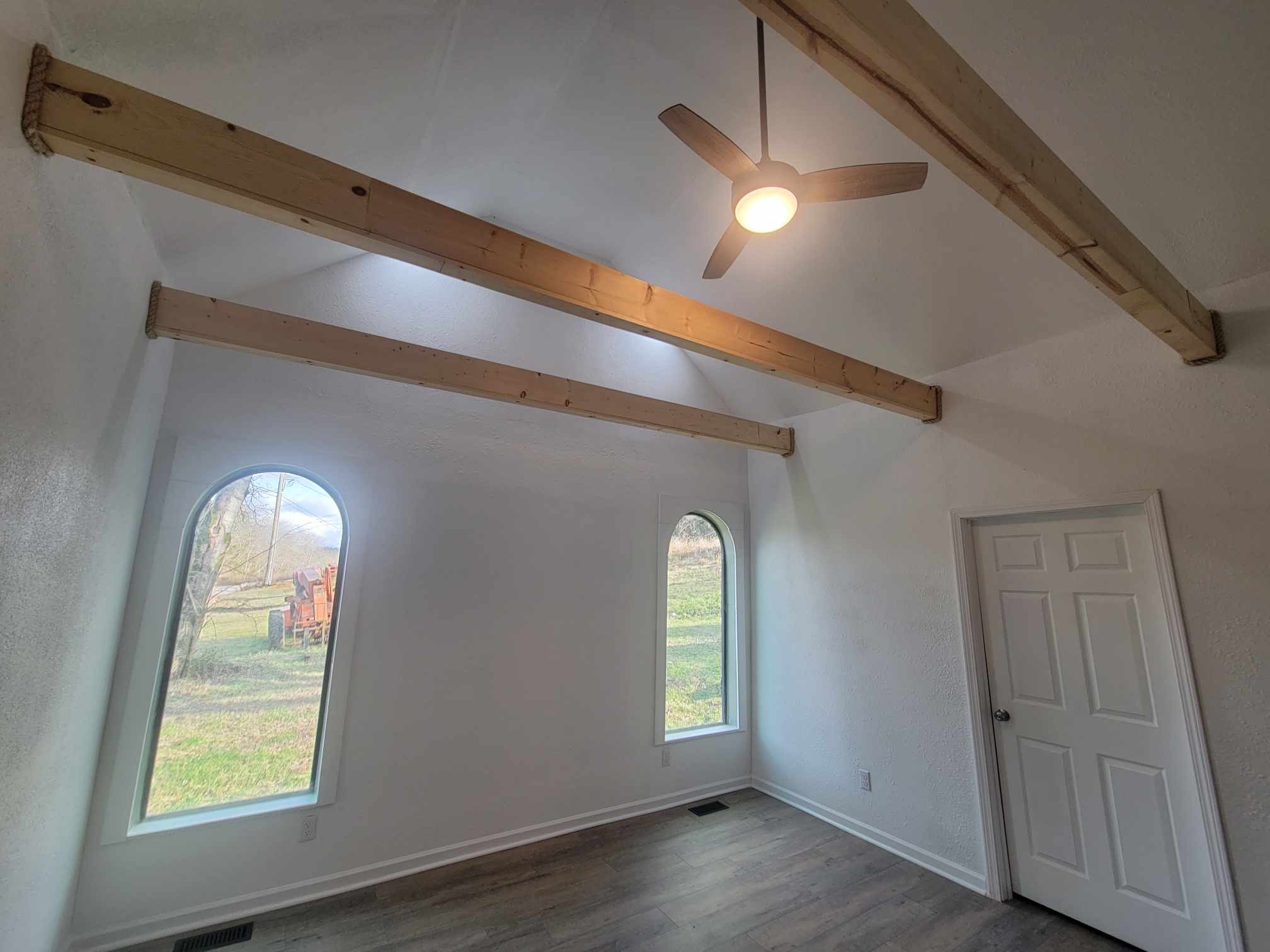 363 Enigma Road Chestnut Mound, TN 38552 - Photo 13 of 60 a view of empty room with window and wooden floor