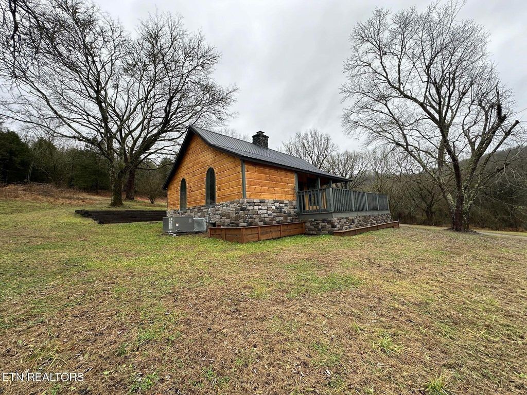 363 Enigma Road Chestnut Mound, TN 38552 - Photo 27 of 60 a front view of house with yard