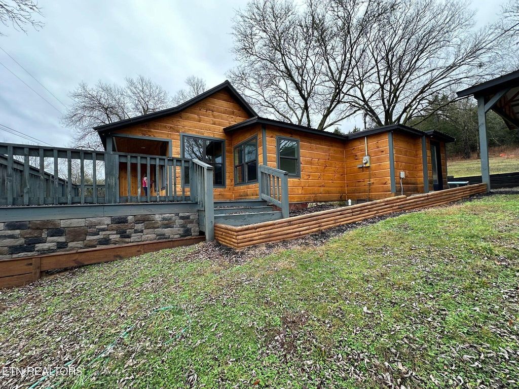 363 Enigma Road Chestnut Mound, TN 38552 - Photo 30 of 60 a front view of a house with a yard