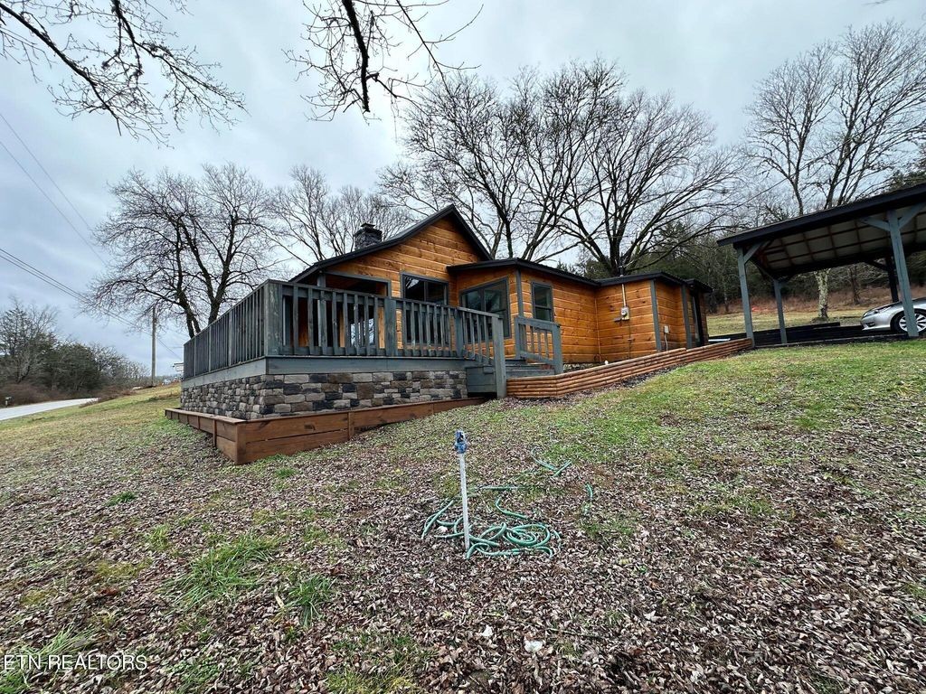 363 Enigma Road Chestnut Mound, TN 38552 - Photo 31 of 60 a front view of a house with garden
