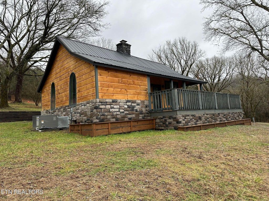 363 Enigma Road Chestnut Mound, TN 38552 - Photo 36 of 60 a view of a house with swimming pool and a yard