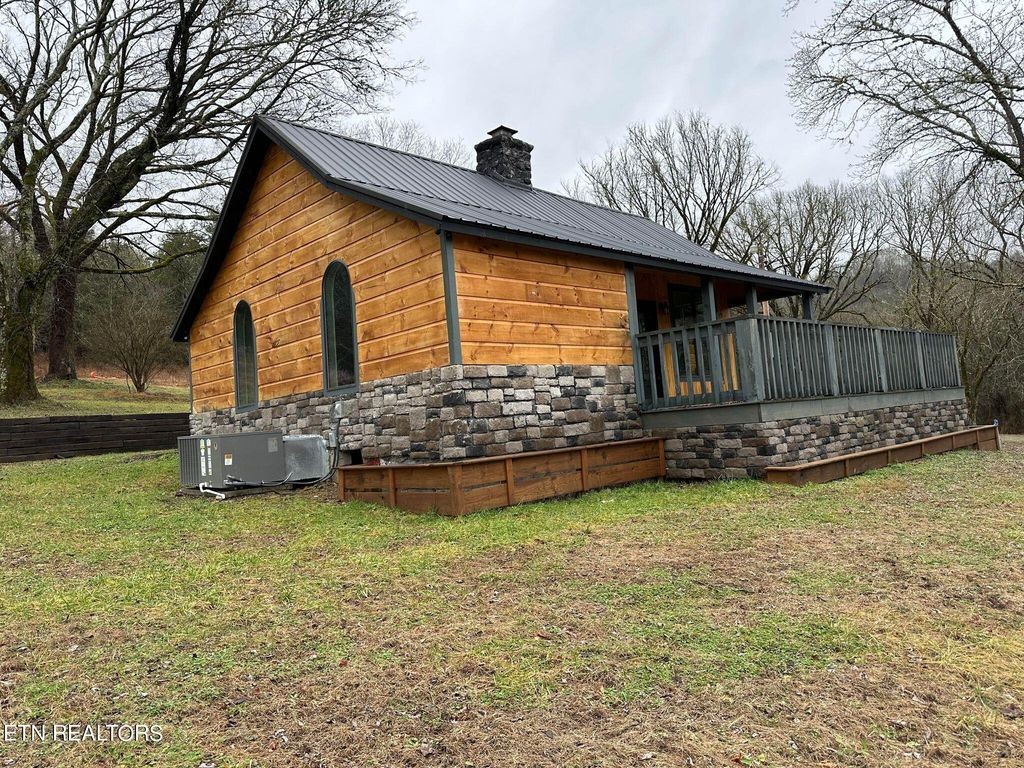363 Enigma Road Chestnut Mound, TN 38552 - Photo 38 of 60 a front view of a house with garden
