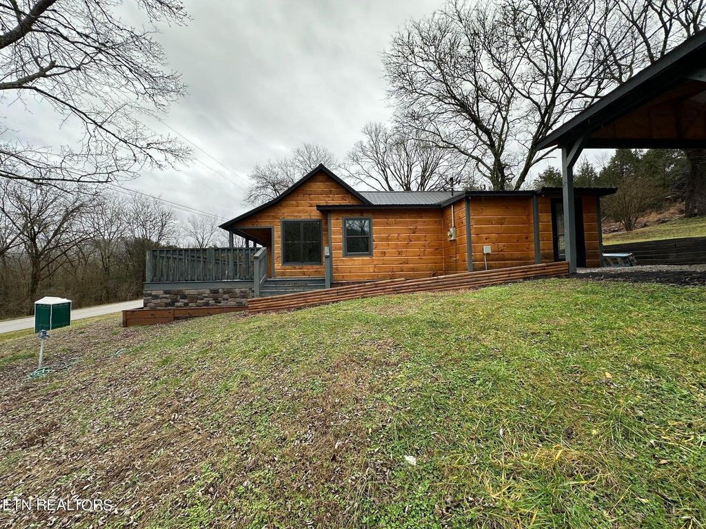 363 Enigma Road Chestnut Mound, TN 38552 - Photo 39 of 60 a view of a house with a yard