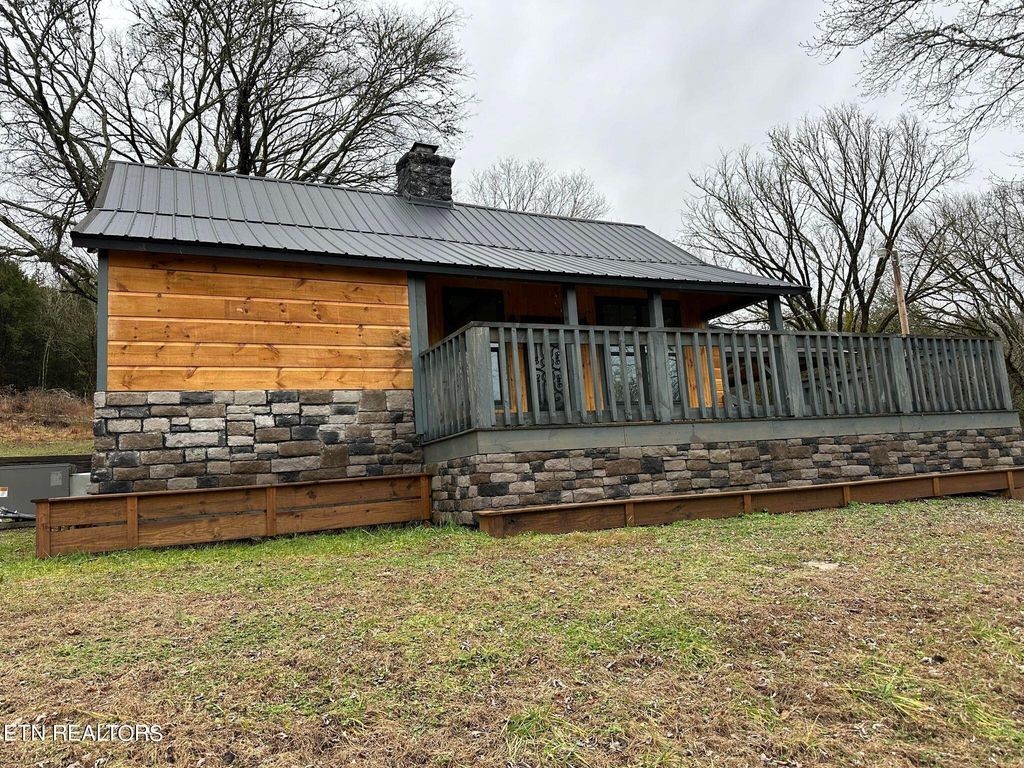 363 Enigma Road Chestnut Mound, TN 38552 - Photo 42 of 60 a front view of a house with a yard