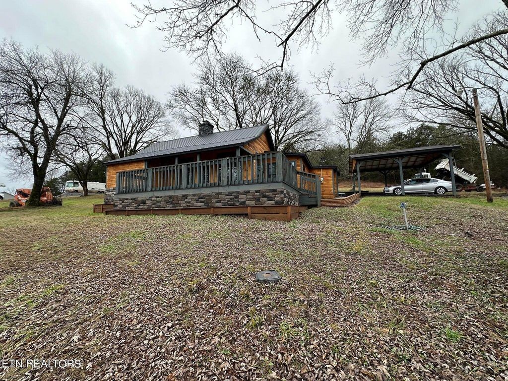 363 Enigma Road Chestnut Mound, TN 38552 - Photo 43 of 60 a front view of a house with garden