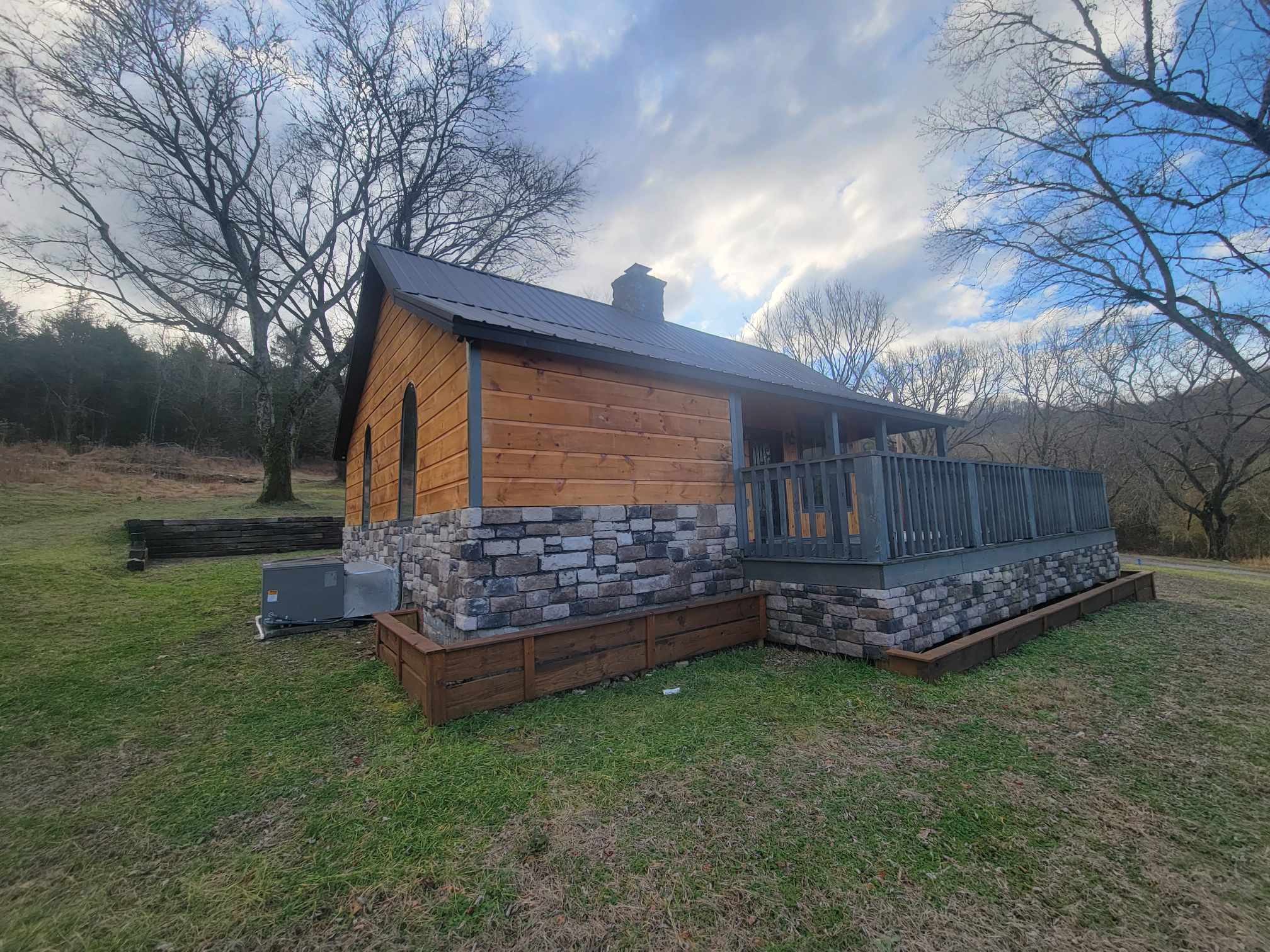 363 Enigma Road Chestnut Mound, TN 38552 - Photo 45 of 60 a view of a backyard with wooden fence