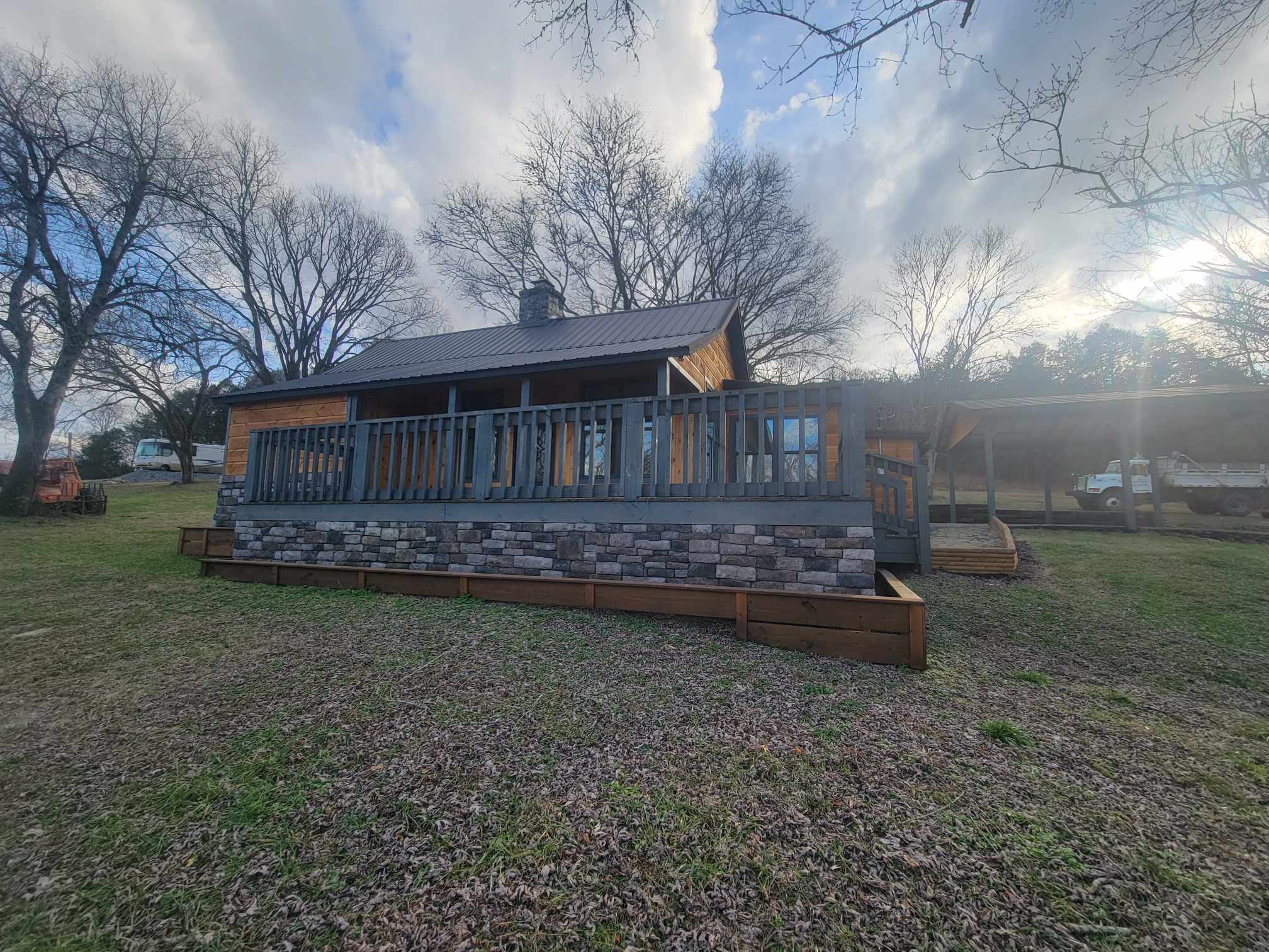 363 Enigma Road Chestnut Mound, TN 38552 - Photo 49 of 60 a view of a house with backyard and garden