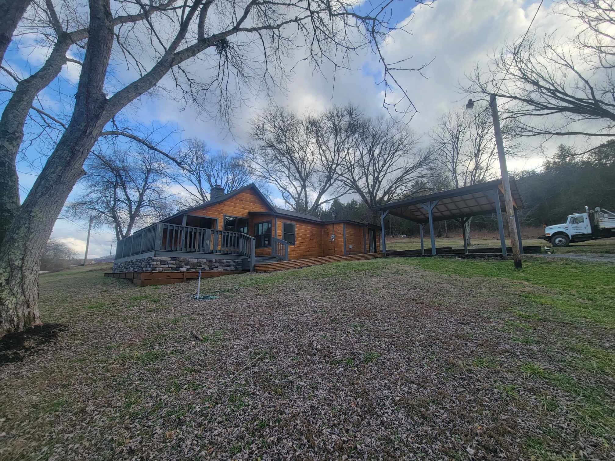 363 Enigma Road Chestnut Mound, TN 38552 - Photo 51 of 60 a view of a house with a yard