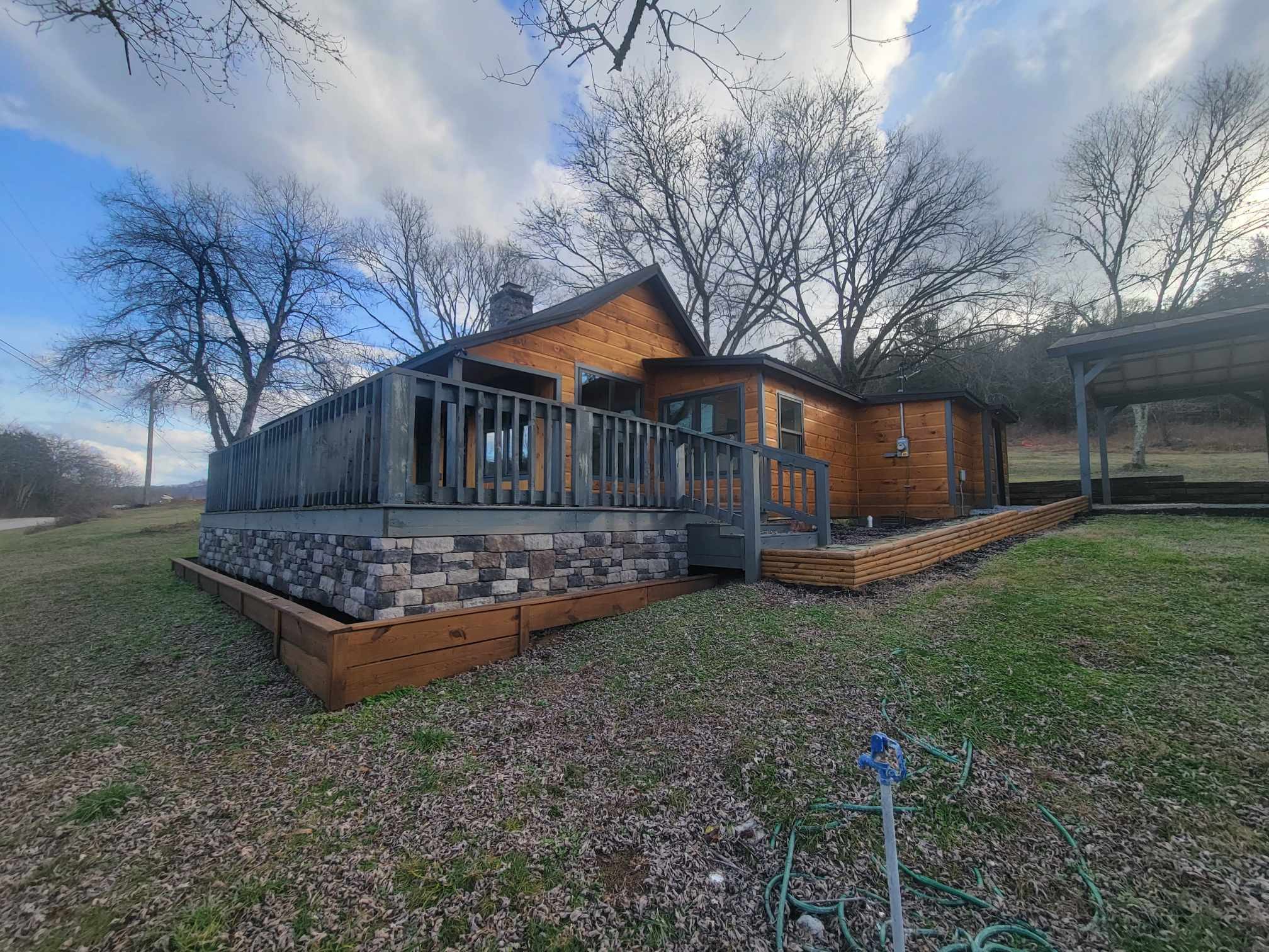 363 Enigma Road Chestnut Mound, TN 38552 - Photo 52 of 60 a front view of a house with garden