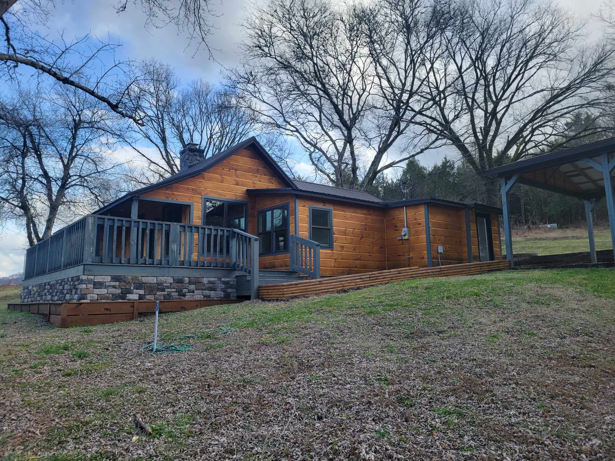 363 Enigma Road Chestnut Mound, TN 38552 - Photo 54 of 60 a front view of a house with garden