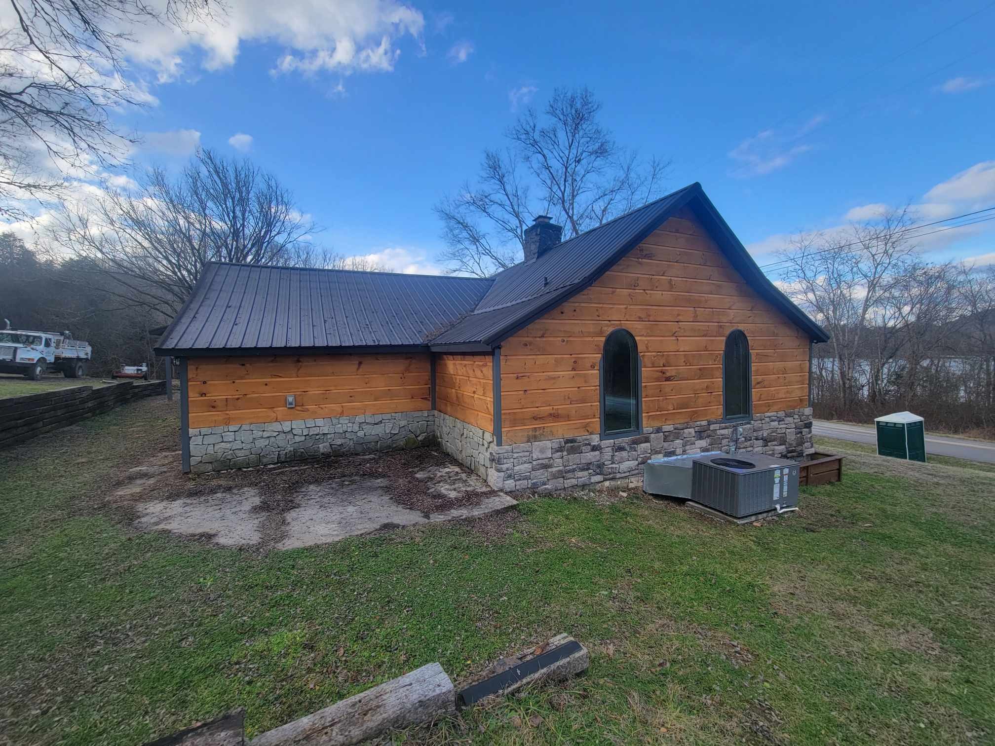 363 Enigma Road Chestnut Mound, TN 38552 - Photo 55 of 60 a backyard of a house with table and chairs