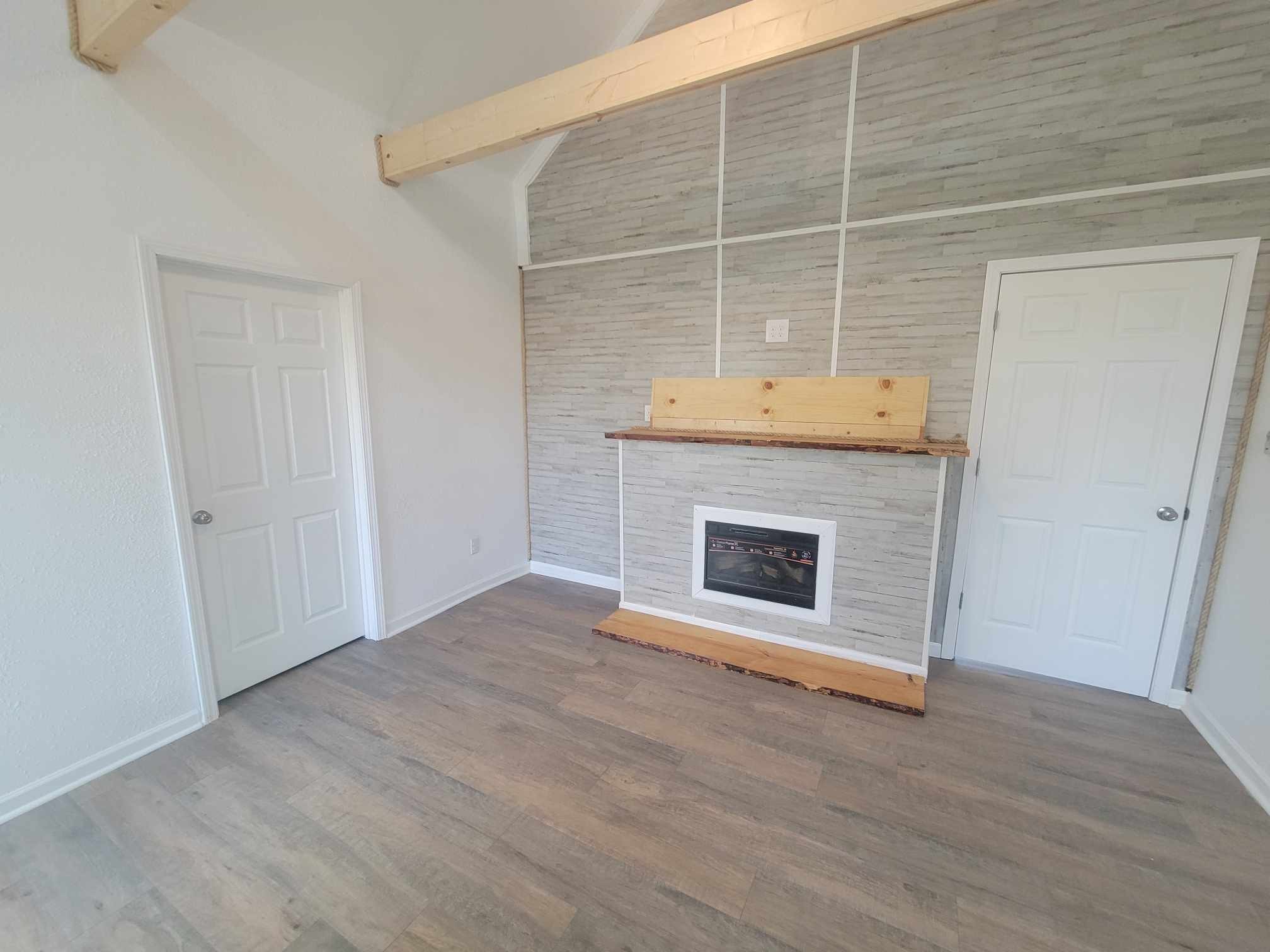 363 Enigma Road Chestnut Mound, TN 38552 - Photo 6 of 60 a view of an empty room with wooden floor and a window