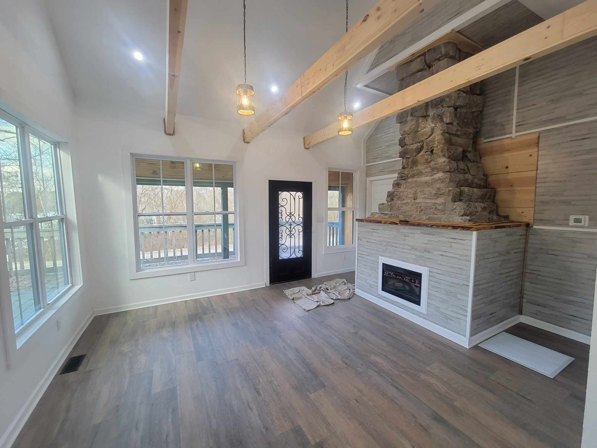 363 Enigma Road Chestnut Mound, TN 38552 - Photo 7 of 60 an empty room with windows and fireplace