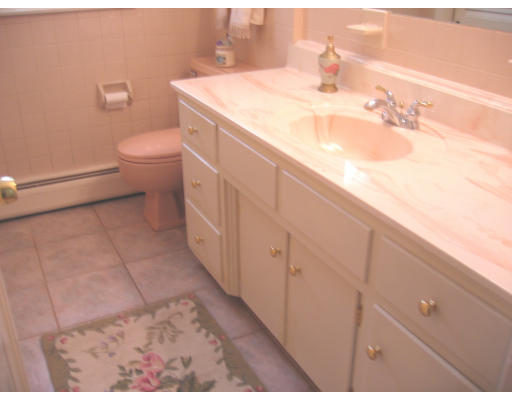 9 Russell Road Wilbraham, MA 01095 - Photo 12 of 12 a bathroom with a sink a toilet and vanity
