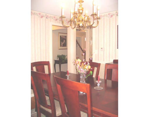 9 Russell Road Wilbraham, MA 01095 - Photo 7 of 12 a view of a dining room with furniture and chandelier