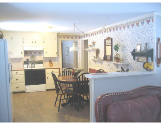 9 Russell Road Wilbraham, MA 01095 - Photo 9 of 12 a kitchen with a sink cabinets and window