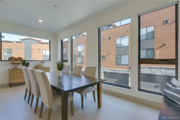 a view of a dining room with furniture and window