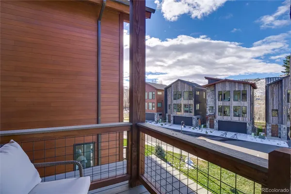 a bedroom with a bed and a chair