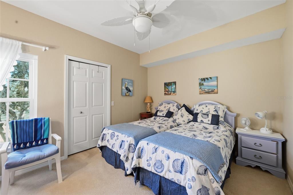 5122 Northridge Road, Unit 210 Sarasota, FL 34238 - Photo 18 of 36 a bedroom with a bed and a couch