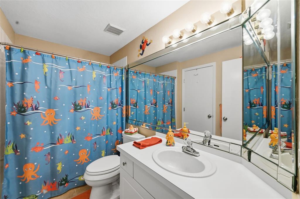 5122 Northridge Road, Unit 210 Sarasota, FL 34238 - Photo 20 of 36 a bathroom with a sink toilet and shower