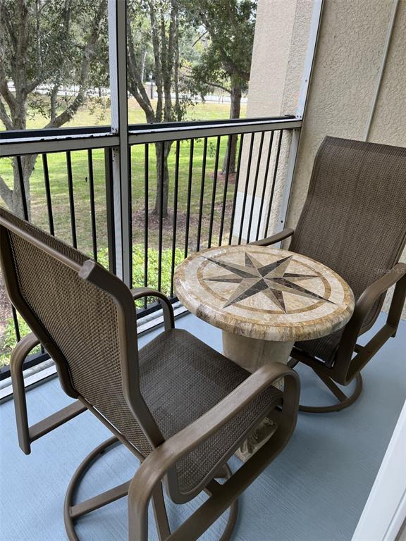 5122 Northridge Road, Unit 210 Sarasota, FL 34238 - Photo 26 of 36 a balcony with furniture and a window