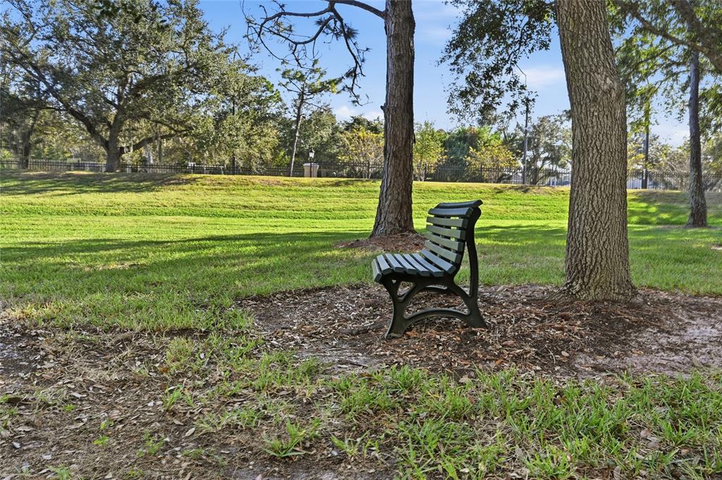 5122 Northridge Road, Unit 210 Sarasota, FL 34238 - Photo 27 of 36 a view of a park with large trees