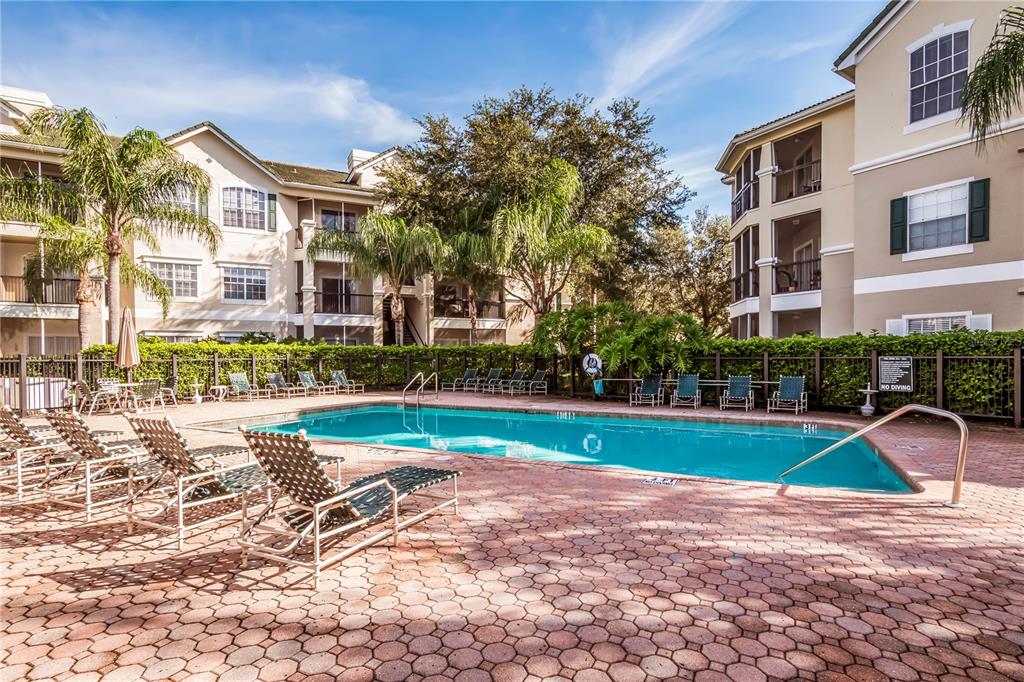 5122 Northridge Road, Unit 210 Sarasota, FL 34238 - Photo 32 of 36 a view of a house with a yard and plants