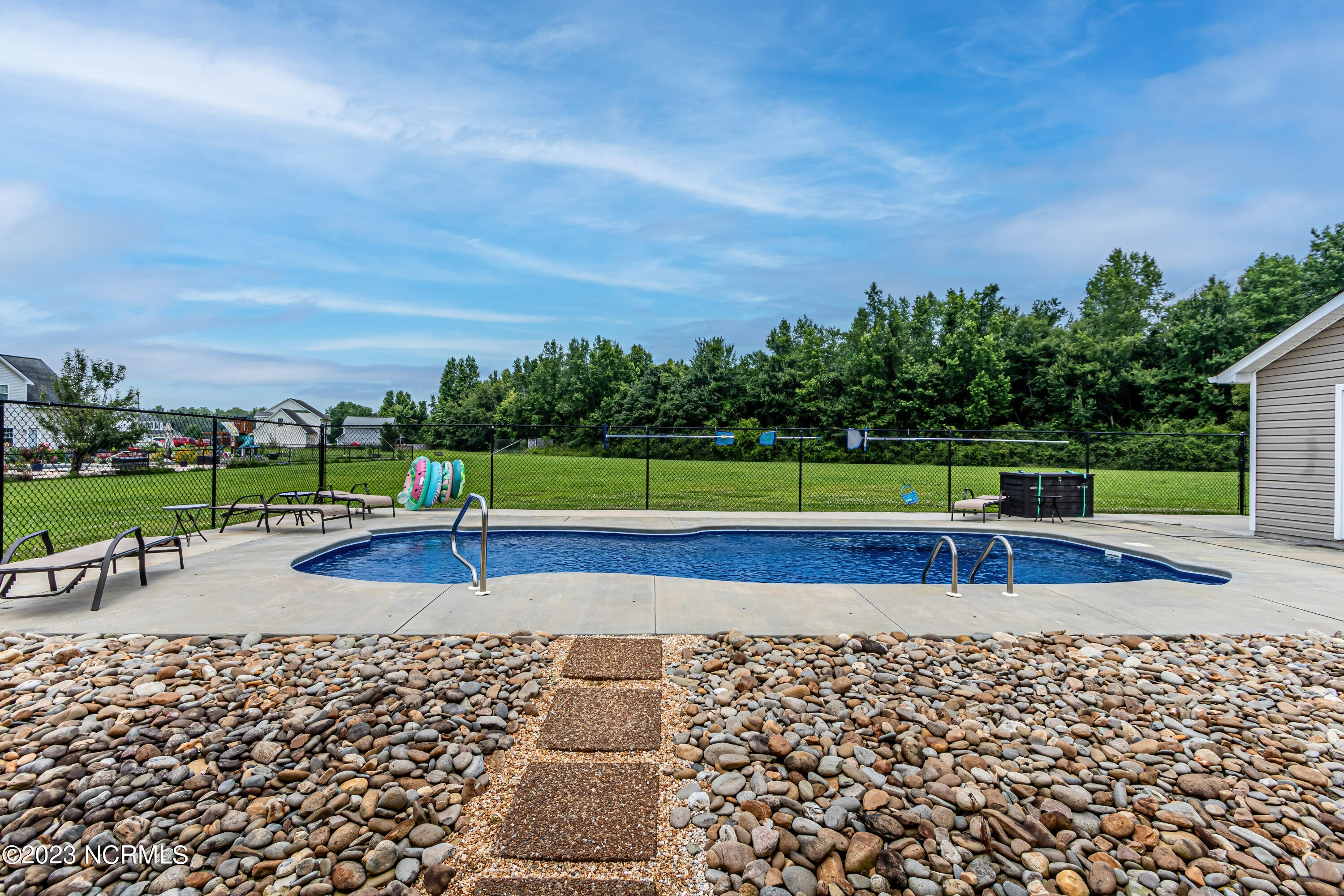 1428 Haws Run Road Maple Hill, NC 28454 - Photo 33 of 55 Backyard with pool