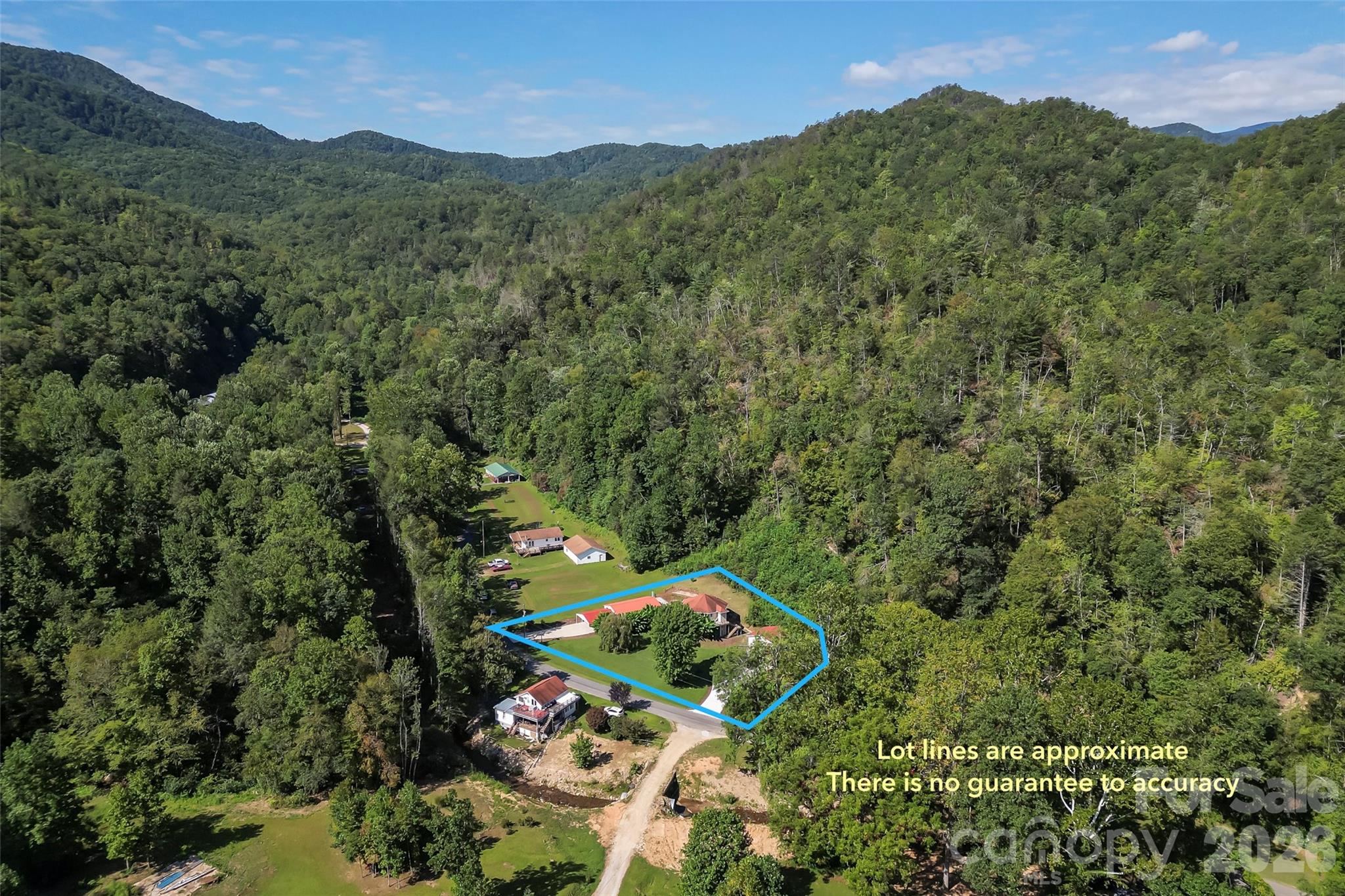 214 Locust Cove Road Marion, NC 28752 - Photo 11 of 47 an aerial view of a house with a yard
