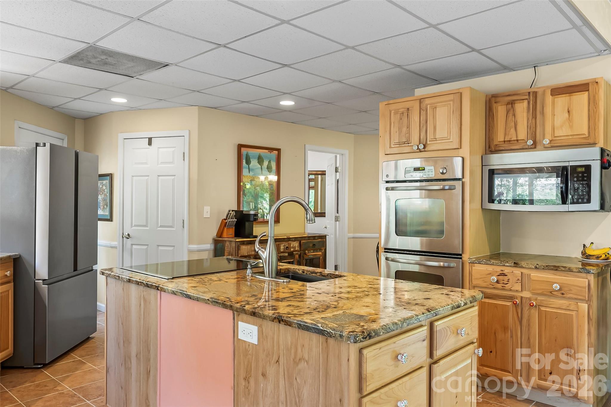 214 Locust Cove Road Marion, NC 28752 - Photo 16 of 47 a kitchen with stainless steel appliances granite countertop a refrigerator and a sink