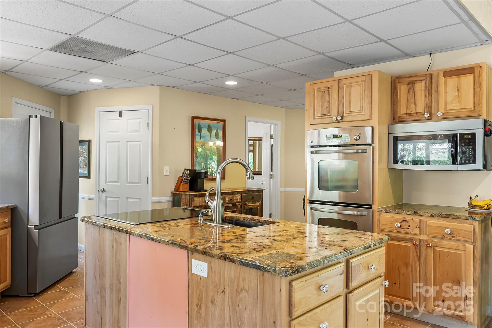 214 Locust Cove Road Marion, NC 28752 - Photo 17 of 47 a kitchen with stainless steel appliances granite countertop a refrigerator and a sink