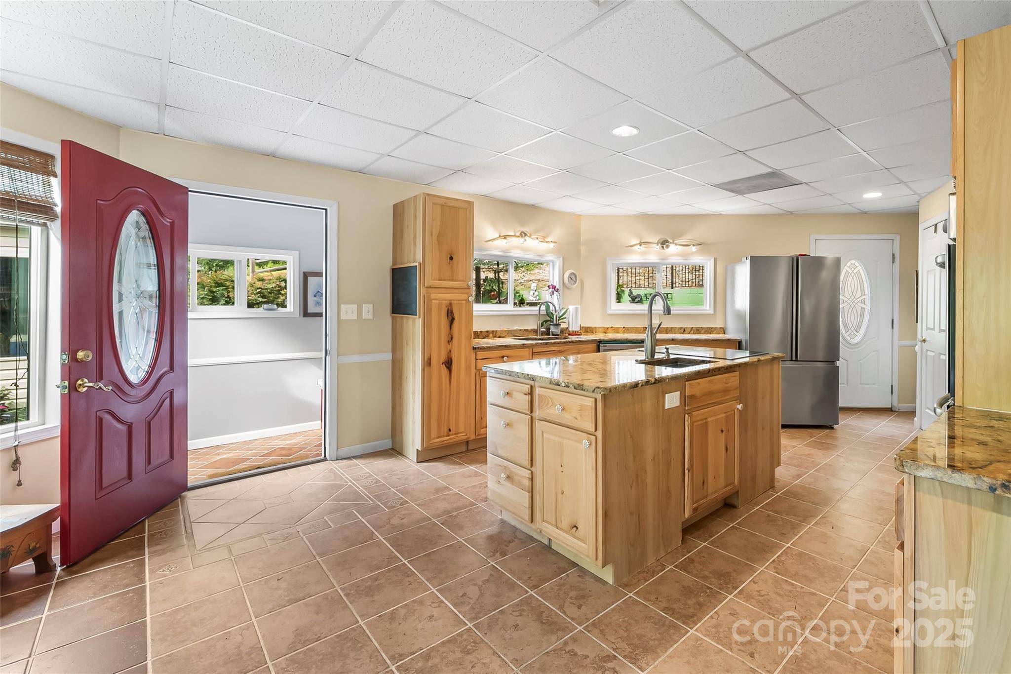 214 Locust Cove Road Marion, NC 28752 - Photo 18 of 47 a kitchen with stainless steel appliances granite countertop a refrigerator and a stove
