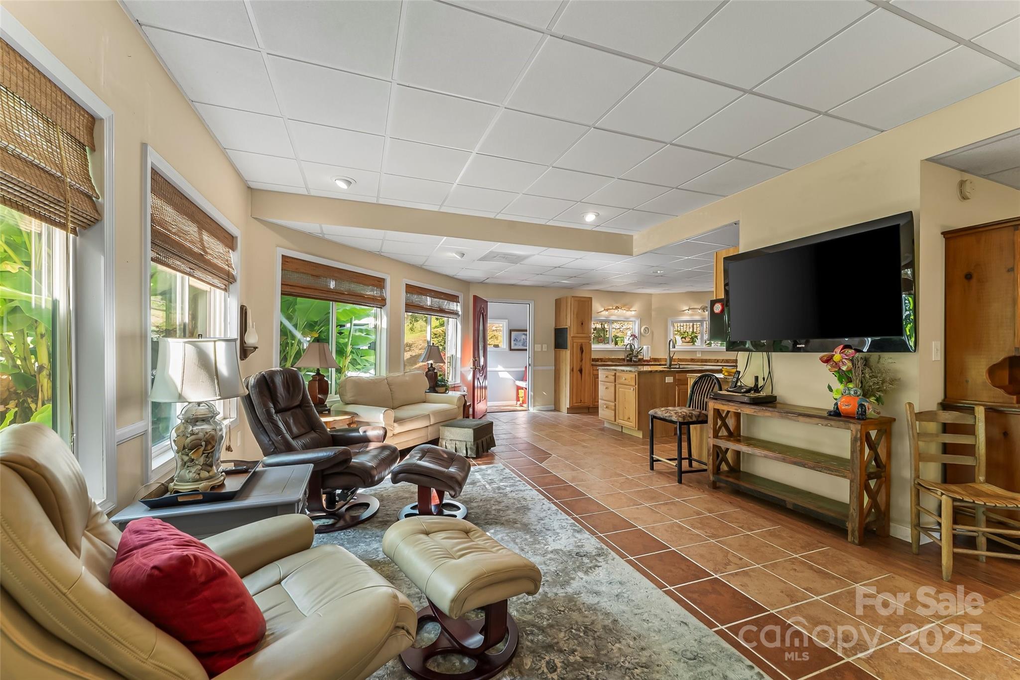 214 Locust Cove Road Marion, NC 28752 - Photo 21 of 47 a living room with furniture and a flat screen tv
