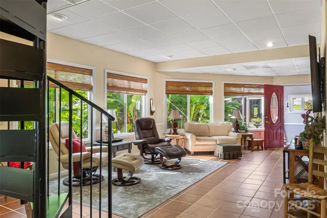 a view of a house with backyard sitting area and garden