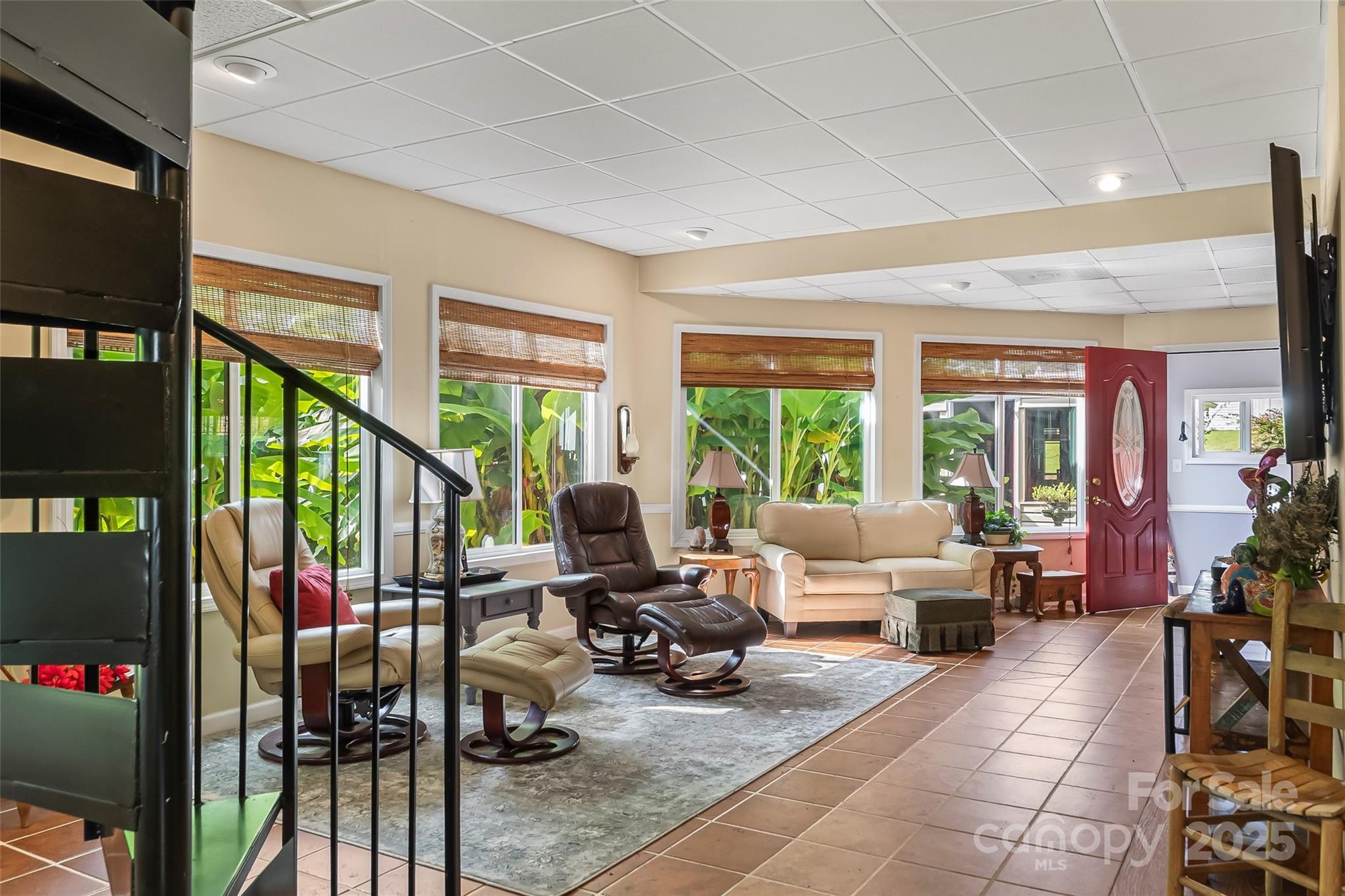 214 Locust Cove Road Marion, NC 28752 - Photo 22 of 47 a living room with furniture large window and flat screen tv