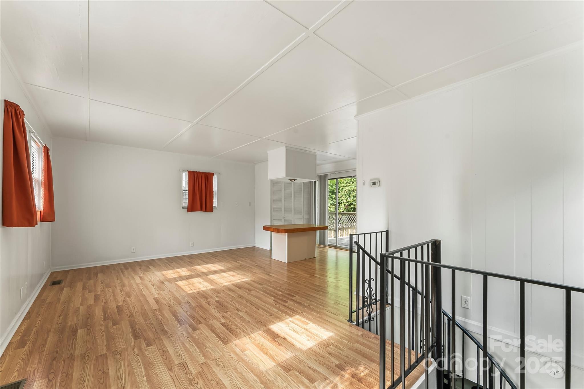 214 Locust Cove Road Marion, NC 28752 - Photo 38 of 47 a view of a hallway with wooden floor and a bathroom